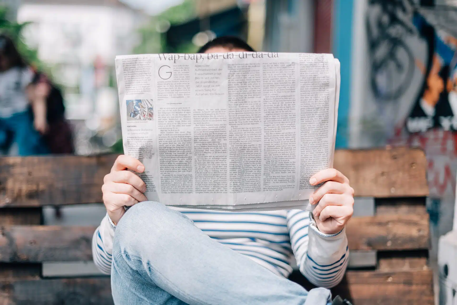 Photograph of man reading a newspaper